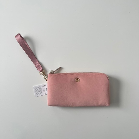 lululemon athletica Handbags - NWT Lululemon pink pastel curved wristlet velour wallet